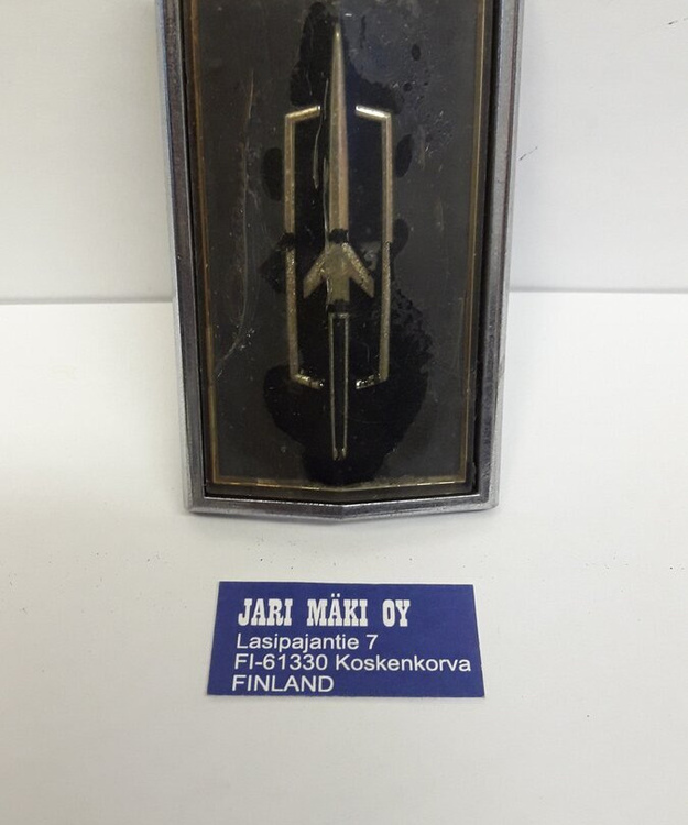 Merkki metallia "Rocket" maskiin Oldsmobile 1976