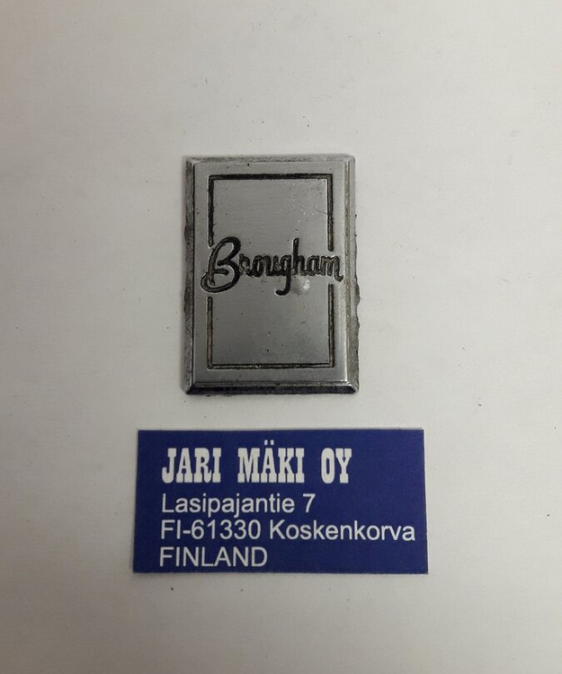 Merkki metallia "Brougham" etulokasuojaan Oldsmobile 1978-1988