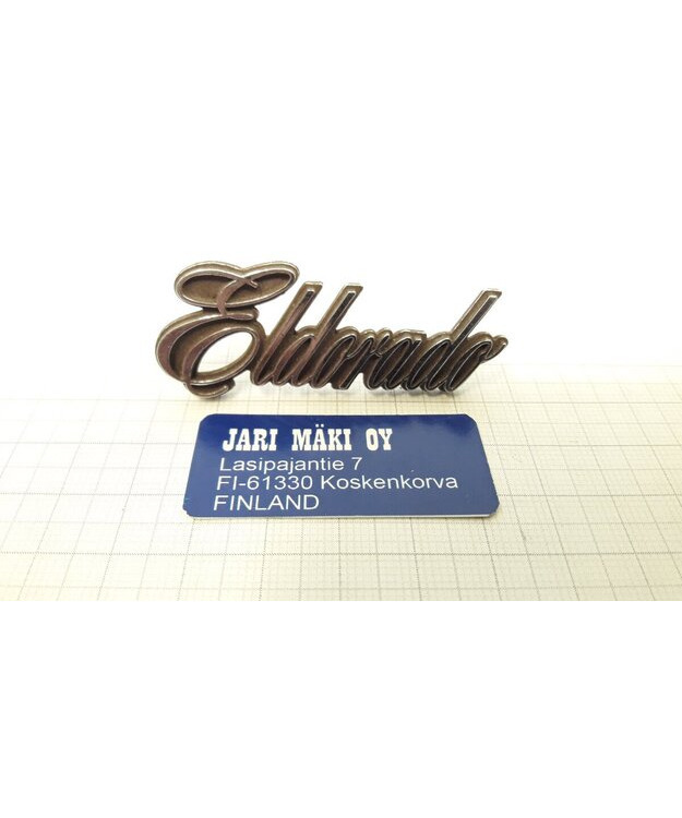 Merkki metallia "Eldorado" hansikaslokeron kanteen 1978-1985