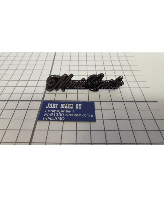 Merkki metallia oviverhoiluun Chevrolet Monte Carlo 1973-1977