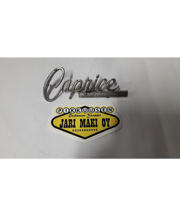 Merkki metallia tavaratilan kanteen Chevrolet Caprice 1966-1968